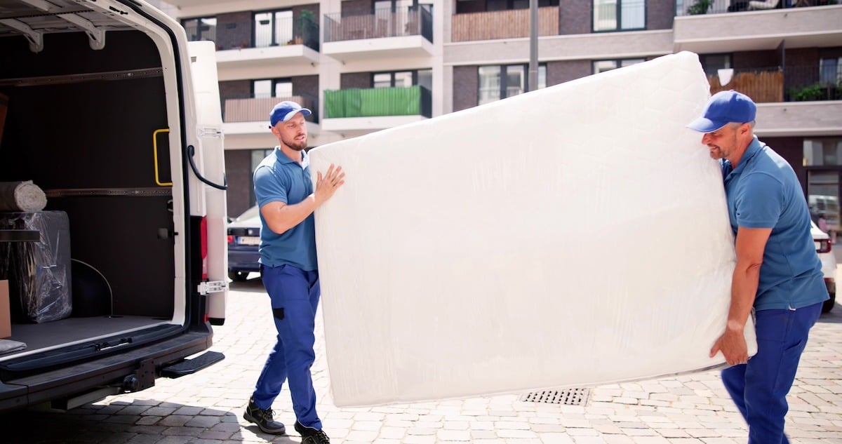 Two Delivery Men Delivering a Mattress